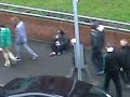 a mad beggar at the glasgow celtic fc begging for money lol