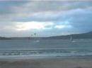 Kiteboarder Jumps Windsurfer