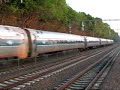 An Acela reg. passes an inbound MBTA into Attleboro Station