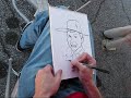 here is a video of me drawing a young boy at a festival.