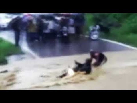 Caught on camera: Youth attempts to wade through rushing water, gets swept away