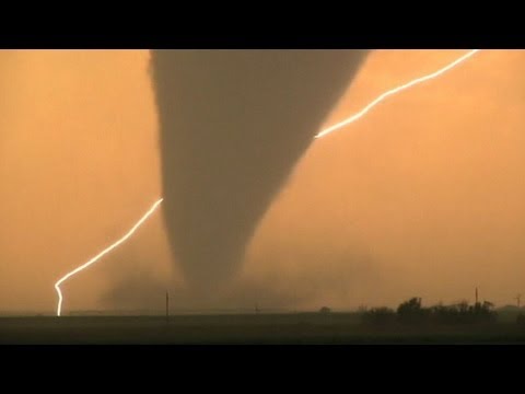 On - At least four tornadoes touch down in Kansas; heavy rain and winds on its way.