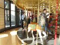 Jill with M & L on carousel at museum Jill with M & L on carousel at museum