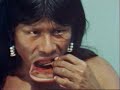 Kayapo Indians eat, drink and smoke wearing lip disks