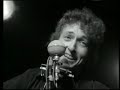 bob dylan - chimes of freedom 1964 live

far between finished sundown's an' midnight's broken toll
we ducked inside the doorway as thunder went crashing
as majestic bells of bolts struck shadows in the sounds
seeming to be the chimes of freedom flashing
flashing for the warriors whose strength is not to fight
flashing for the refugees on the unarmed road of flight
and for each an' ev'ry underdog soldier in the night
and we gazed upon the chimes of freedom flashing.

through the city's melting furnace, unexpectedly we watched
with faces hidden while the walls were tightening
as the echo of the wedding bells before the blowin' rain
dissolved into the bells of the lightning
tolling for the rebel, tolling for the rake
tolling for the luckless, the abandoned an' forsaked
tolling for the outcast, burnin' constantly at stake
and we gazed upon the chimes of freedom flashing.

through the mad mystic hammering of the wild ripping hail
the sky cracked its poems in naked wonder
that the clinging of the church bells blew far into the night
leaving only bells of lightning and its thunder
striking for the gentle, striking for the kind
striking for the guardians and protectors of the mind
and the unpawned painter behind beyond his rightful time
and we gazed upon the chimes of freedom flashing.

through the wild cathedral evening the rain unraveled tales
for the disrobed faceless forms of no position
tolling for the tongues with no place to bring their thoughts
all down in taken-for-granted situations
tolling for the deaf and blind, tolling for the mute
tolling for the mistreated, mateless mother, the mistitled prostitute
for the misdemeanor outlaw, chased and cheated by pursuit
and we gazed upon the chimes of freedom flashing.

tolling for the searching, on their speechless, seeking trail
for the lonesome-hearted lovers with too personal a tale
and for each unharmful, gentle soul misplaced inside a jail
and we gazed upon the chimes of freedom flashing.

starry-eyed and laughing as i recall when we were caught
trapped by no track of hours for they hanged suspended
as we listened one last time an' we watched with one last look
spellbound an' swallowed 'til the tolling ended
tolling for the aching ones whose wounds cannot be nursed
for the countless confused, accused, misused, strung-out ones and worse
and for every hung-up person in the whole wide universe
and we gazed upon the chimes of freedom flashing.