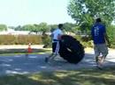 Iowa games, strongman competitiontractor tire flip, as many flips as possible in 1 minute