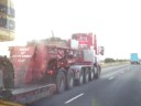 Scania wideload on motorway with excavator