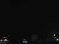 Texas tornado siren with lightning flashes