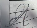 True sparkle of a Swarovski Crystal Monogram Wedding Cake Topper