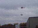 Helicopter lifts HVAC units