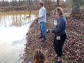 Briana catches a fish but is scared of it. Briana catches a fish but is scared of it.