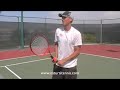 Santoro two handed slice with two handled tennis racket
