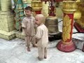 kids ringing bells at a temple
