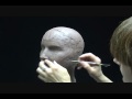 Sculpting a female head in clay