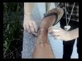 black fella getting leg waxed