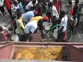 Red Water Truck in Cité Soleil, Haiti- Reiser Relief - Fresh Water Delivery