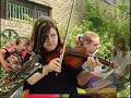 give it a chance. basically this is made with players of varying ability, many are complete beginners. 
a new compostion is broken down into notes that can be played with any instrument. then over a number of days and with a metronome we went to lots of diffferent schools and locations, and got kids and people to play one or two notes. then this was all editied together to make what you see here. it is all recorded live, the soundtrack made up of many different elements, some are played in sunderland, some newcastle, some at night inside, some outside during the day etc. i hope this makes sense. obviously timing was a problem, but when is it not...this is a way to try and introduce peopel to the playing expereience and in away is a deconstruction of the idea of the orchestra, as never did any of the playing froups meet, and the score only exists in the edit.