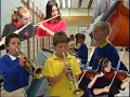 give it a chance. basically this is made with players of varying ability, many are complete beginners. 
a new compostion is broken down into notes that can be played with any instrument. then over a number of days and with a metronome we went to lots of diffferent schools and locations, and got kids and people to play one or two notes. then this was all editied together to make what you see here. it is all recorded live, the soundtrack made up of many different elements, some are played in sunderland, some newcastle, some at night inside, some outside during the day etc. i hope this makes sense. obviously timing was a problem, but when is it not...this is a way to try and introduce peopel to the playing expereience and in away is a deconstruction of the idea of the orchestra, as never did any of the playing froups meet, and the score only exists in the edit.