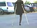 one legged female street crutching