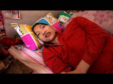 defen - The world's tallest woman, Yao Defen, is prematurely discharged from hospital after recovering from a life threatening fall. With the odds stacked against he...
