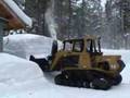 Blowing snow with ASV Posi-Track and Unimog
