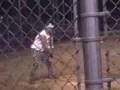Guy hits a P in softball game