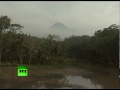 Volcano coughs, turns air into ash in Indonesia