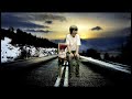 Green Screen Midget sits on a chair in the middle of the road