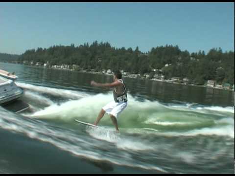 Mark riding behind a Centurion on Inland Surfer board