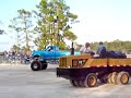 trucks pulling sled
