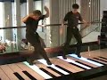 Some guys play songs on the massive piano from the film 'Big' - including 'chopsticks' and 'heart and soul'.