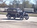1910-1920s model car passing by