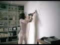 A woman trying too drill