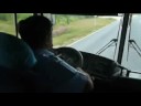 crazy bus driver plays guitar whilst driving