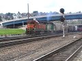 EMD GP39-2 #2711 & GP38-2 #2269 BNSF locomotives with mixed local train at Interbay yard in Seattle, WA backing up Full throttle.