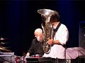 pierre favre ensemble: erba luce
composed by pierre favre

pierre favre: drums, percussion
h�l�ne breschand: harp
chris biscoe: saxes, alto clarinette
michel godard: tuba, serpent
baenz oester: double bass
philipp schaufelberger: guitar
wolfgang zwiauer: bass guitar 

back with ecm after a decade, percussionist pierre favre has delivered one of his most captivating albums. it is hardly surprising that the musician who produced such unexpected colours and textures as a solo act and from a percussion quartet (the singing drums of the 1980s) should find so many possibilities in the almost wilfully unconventional instrumentation employed for this edition of the ensemble.
while there is a strong rhythmic backbone to these seven favre compositions, with bass, drums, harp and guitar often acting together as a unit to carry the pulse, it is the agreeable melodies and the ingenious, fresh and attractive voicings that distinguish the session. from the opening 
