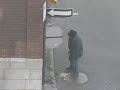 Hobo rocks a piss in broad daylight outside of a bar in Montréal