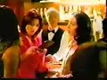 a hot japanese girl actress norkia fujiwara in a jphone commercial.  look at the great hair on the blonde guy standing next to her.