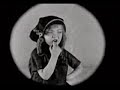 A 1923 animated film that is part live action by Walt Disney. Alice is played by a young actress named Virginia Davis. Alice visits an animation studio, where the animators show her various scenes on their drawing boards. More about the film: www.imdb.com