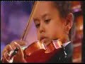 young violinist akim camara performs the dance of the fairies with andre rieu at the new york radio city music hall