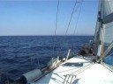 Still shots of a group sailing around the Adriatic on a monohull sailboat.