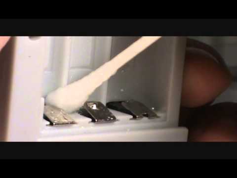 how to clean battery leak in electronic device