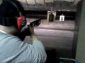 Jonathan shooting a shotgun