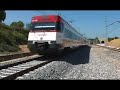 A 333 series locomotive pulling one of the old Talgo III trains from Madrid to Bilbao. This service is not offered anymore with those old trains.