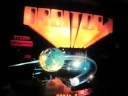 This is a unique pinball machine made by Stern in 1982. The playfield has a contoured clear plastic layer above the cratered planet surface that the ball moves in. It makes for erratic play unlike any other pinball machine. Also, the 