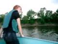 PHIL ATTEMPTING TO DRIVE A BOAT.