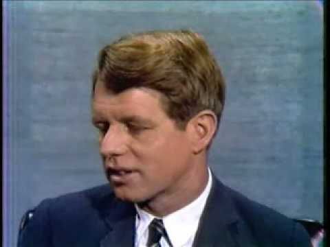 1967 - The two debate against an angry English student in an early international town hall debate.