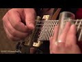 in this tutorial, ivideosongs instructor tim huffman shows basic slide technique and chord changes, and also how to play a i iv v blues progression using the bottleneck slide.  the bottleneck slide tutorial provides a grounding in blues style phrasing and is perfect for the intermediate-level slide player in search of ways to expand creativity.  videos here are in parts - for free downloads of the full, uncut, high quality videos, go to http://www.ivideosongs.com/search/tutorials.aspx