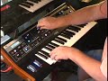 Turning knobs on the Moog LP synthesizer.