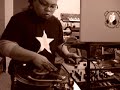 Dj Taboo Scratching with a Mr. Zoggs Sex Wax SHirt